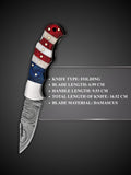 Damascus steel blade pattern detail on American flag custom folding knife