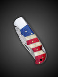 lose up of patriotic red white and blue handle with polished bone accents