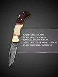 Ripple pattern Damascus steel blade detail on brown and cream folding knife