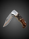 Layered copper Damascus steel blade extended on brown folding pocket knife