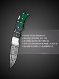 Polished Damascus steel blade pattern detail on green and black folding knife