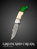 Green and cream handmade Damascus steel folding pocket knife, full view