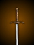 Close up of Heartsbane sword carved wooden grip and bronze fittings