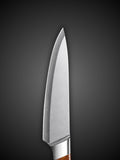Curved Damascus steel blade angle view on handmade kitchen chef knife