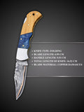 Hand forged copper Damascus steel blade pattern detail on Lara Eagle pocket knife