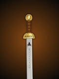 Close up of letter opener sword faux wood hilt and gold pommel