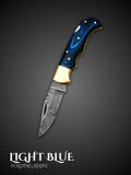 Light blue Damascus steel folding knife with lockback design, full view