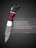 Rippled Damascus steel blade pattern detail on red and black folding knife
